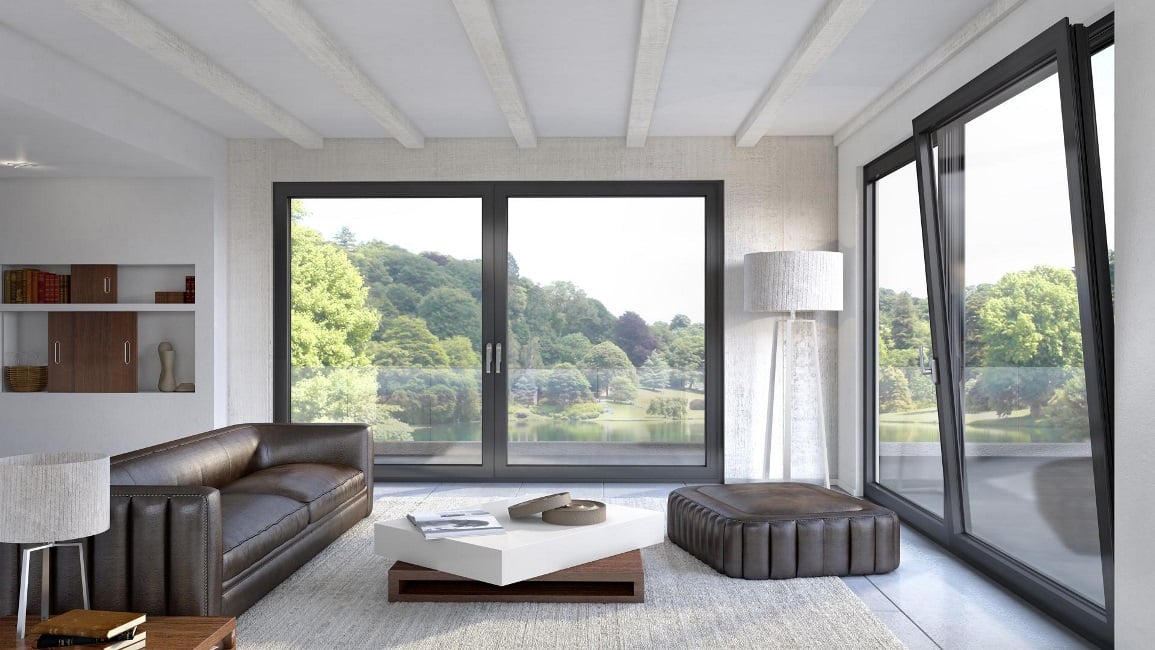 Εσωτερικό σαλονιού με minimal design, καφέ δερμάτινους καναπέδες, και μεγάλα ανοιγόμενα κουφώματα αλουμινίου Alumil SUPREME S91. Εσωτερικό σαλονιού με minimal design, καφέ δερμάτινους καναπέδες, και μεγάλα ανοιγόμενα κουφώματα αλουμινίου Alumil SUPREME S91.