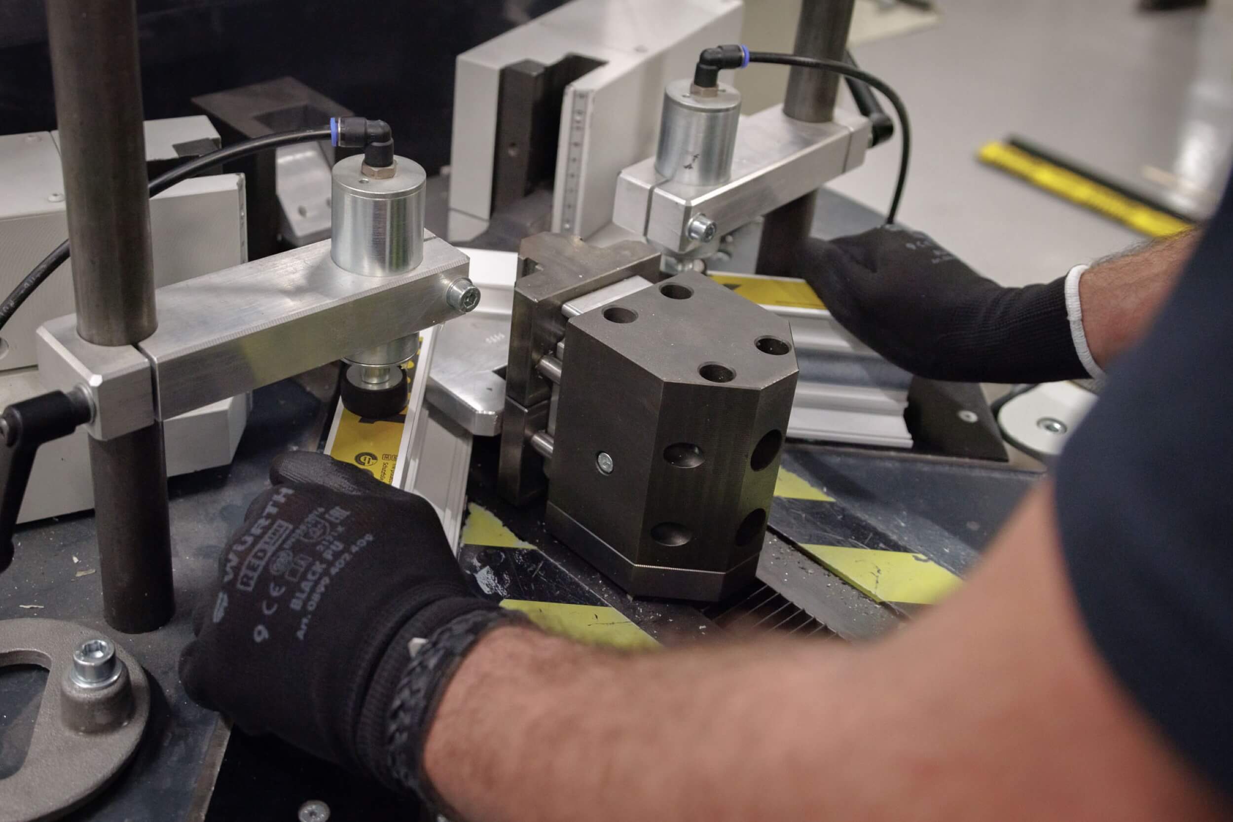 hands of a worker at a machine while in training