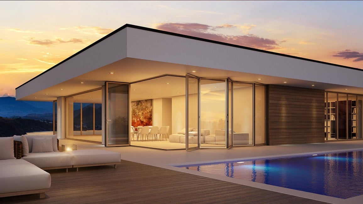 Corner folding door in a detached house with a pool Corner folding door in a detached house with a pool