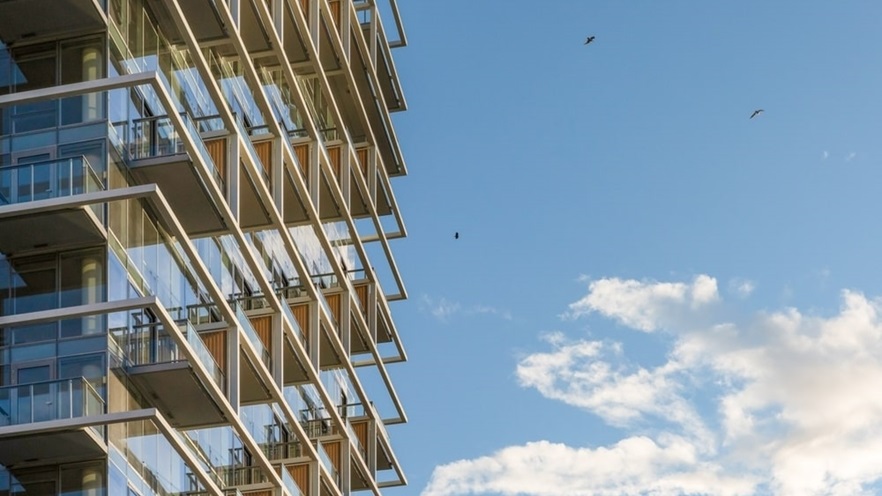 The balconies and the blue sky with birds flying