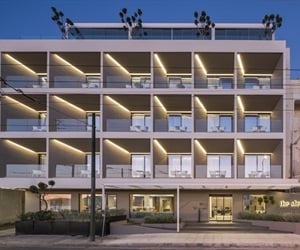 The front of the four storeys hotel at dawn