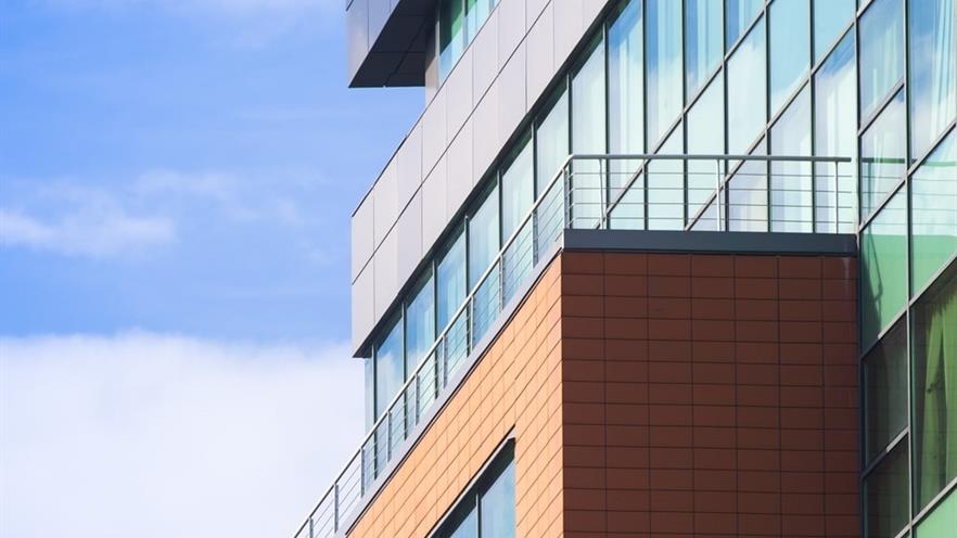 Close up to the cladding under the balcony of the building