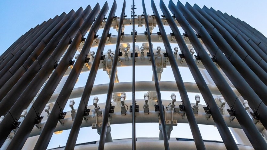 Aluminum louvers cover the building's facade