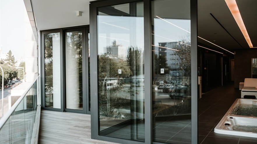 Aluminum windows at angles forming the balcony