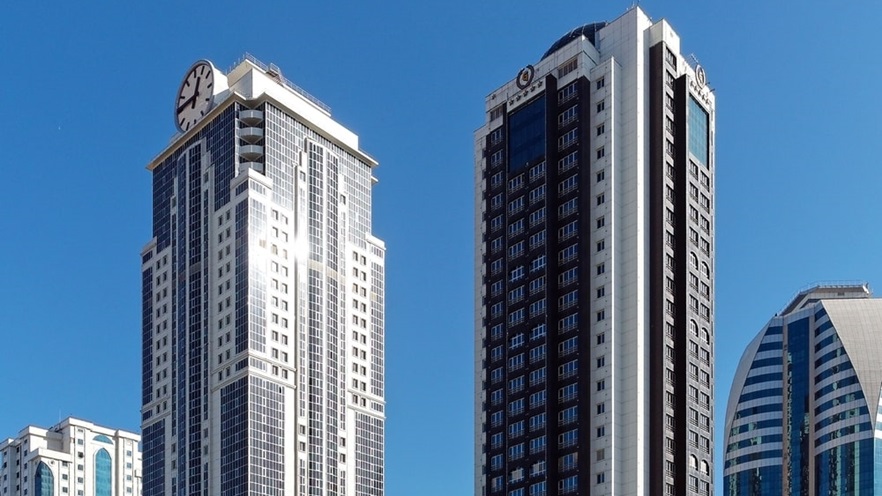 The buildings have curtain walls, windows and balconies