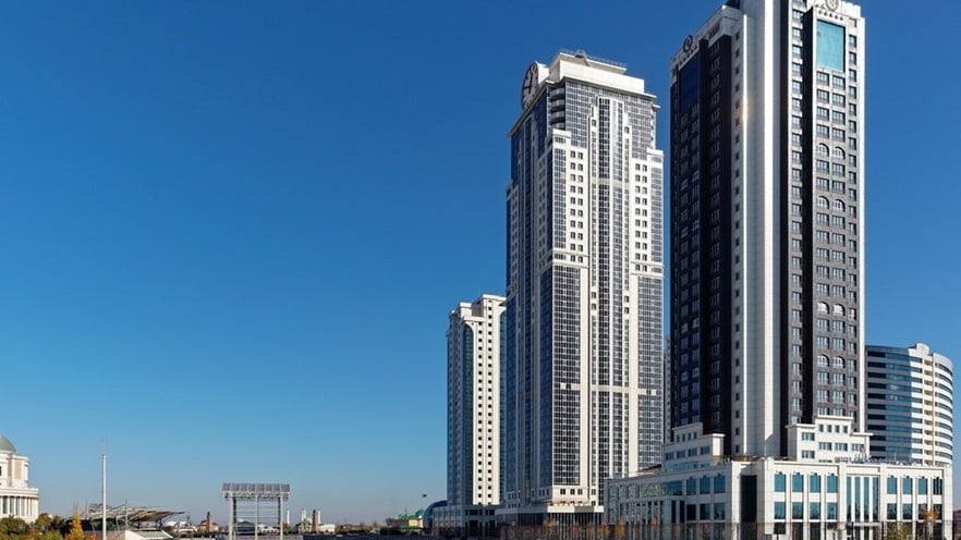 A river is passing next to the buildings
