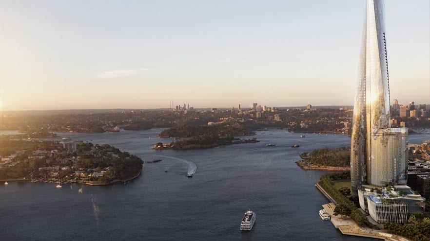 Seaside view of Crown Sydney with its twisting glass tower rising above the waterfront, set against a clear blue sky and calm harbor waters