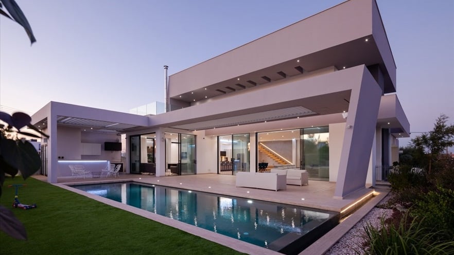 Garden and pool with sitting areas at the back of the house