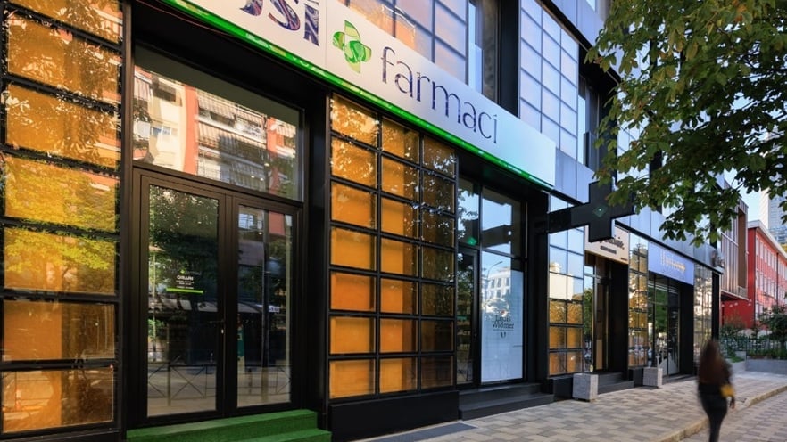 Ground floor of Golden Reflection building featuring a modern shopfront with aluminum curtain walls and large display windows