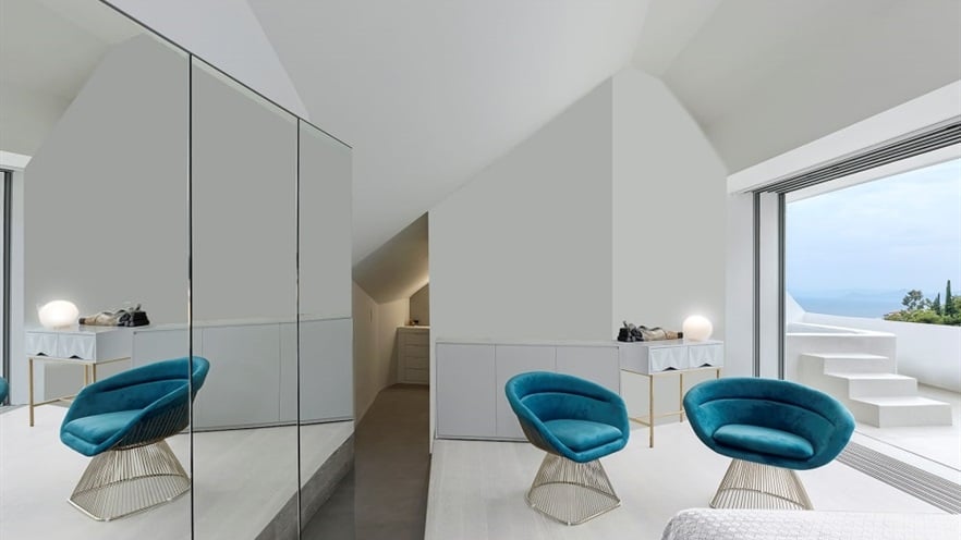 Room with two stylish chairs and mirror