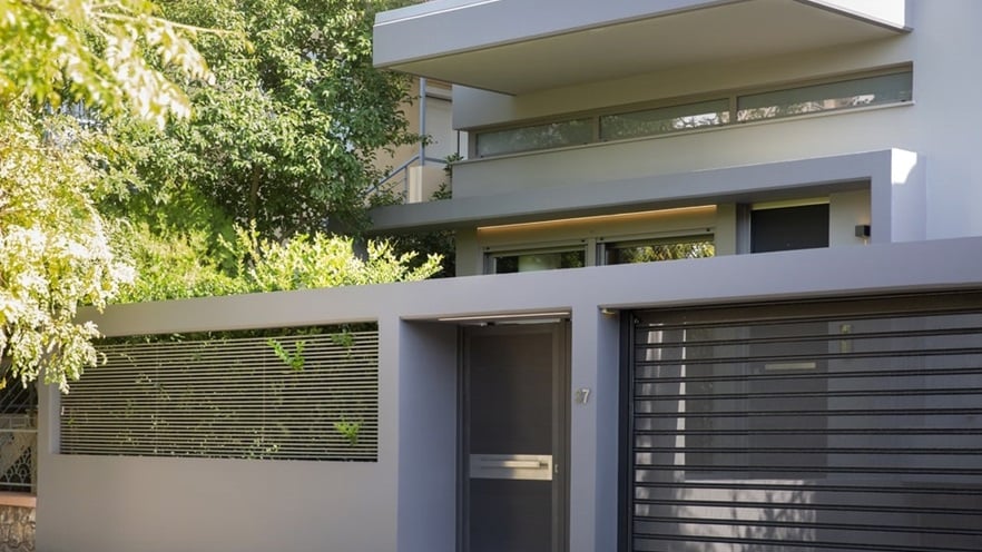 The outdoor fencing and entrance door of the house