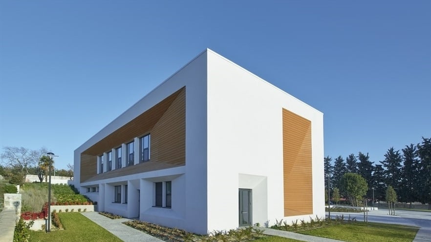 White building with brown cladding