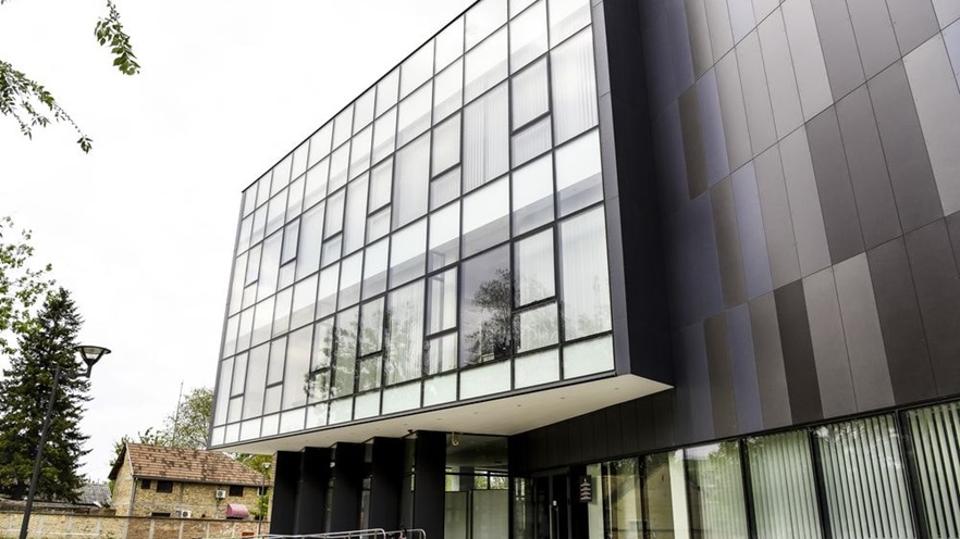 The building's front is covered with a curtain wall