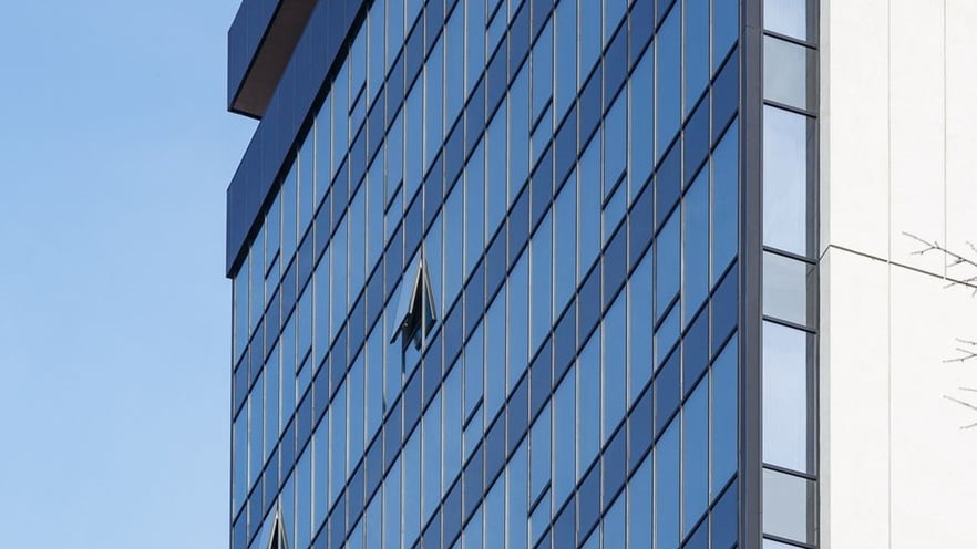The curtain wall façade and some open windows