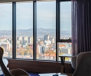 The rooms have a view to the city through the large openings