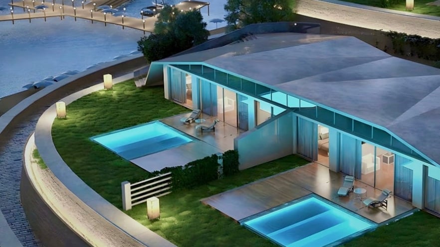 Hotel rooms overlooking a pool with sun loungers, large glass windows, and balconies at Il Monte Galala Resort
