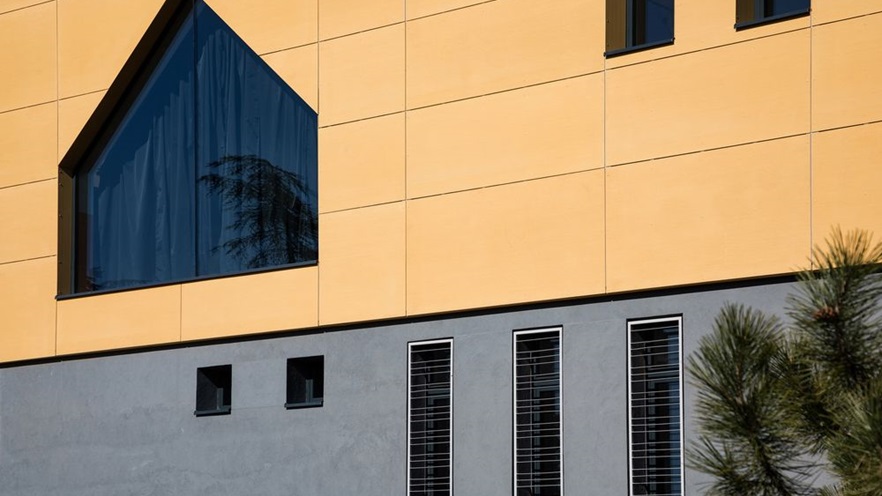 A house-shaped window and a series of rectangle windows
