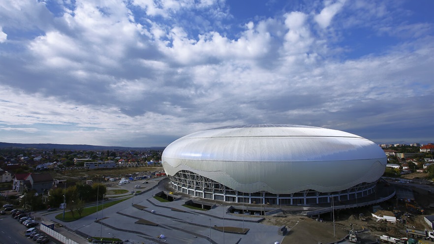 View of the stadium from above, with parking lot