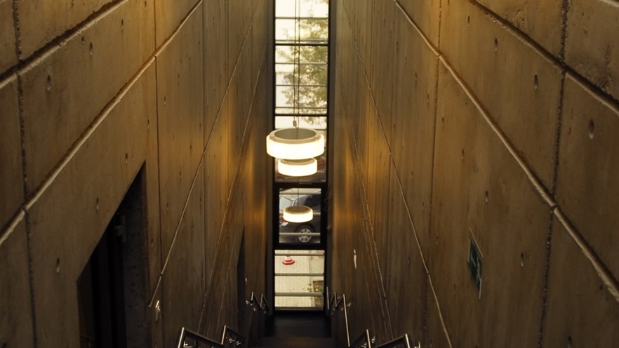 Minimal staircase with concrete walls and modern lighting