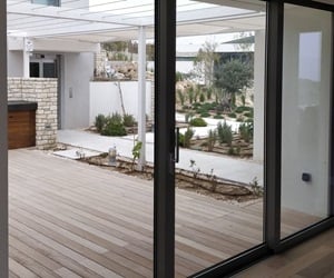 The terrace has a deck and plants