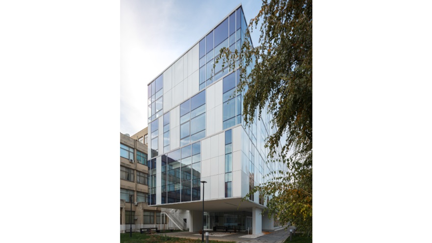 The building is covered in cladding and curtain wall