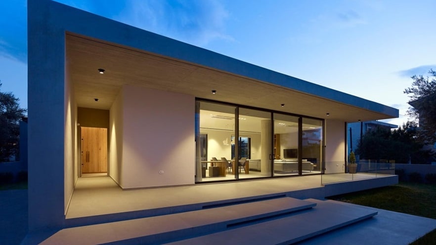 The entry way is next to the large windows