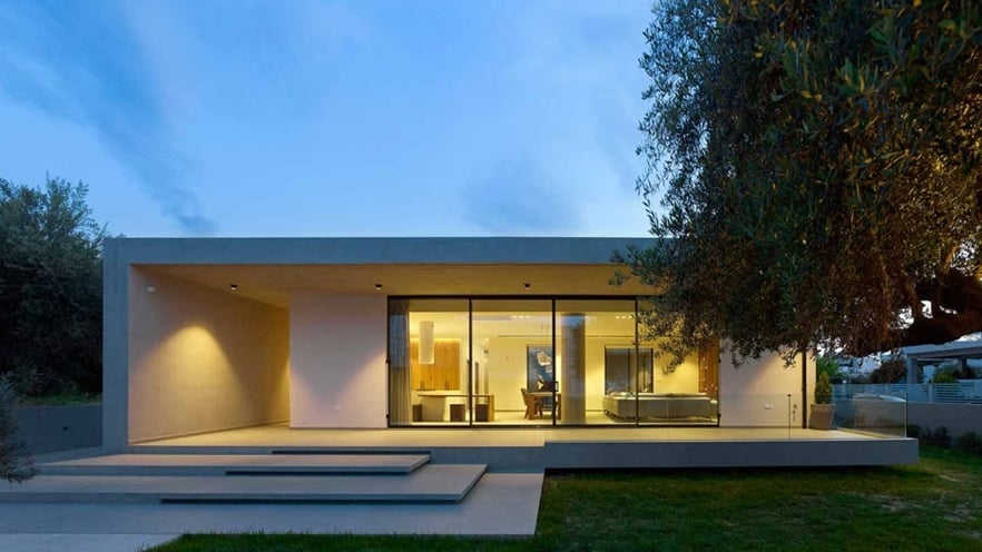 Front of the house with the lights on