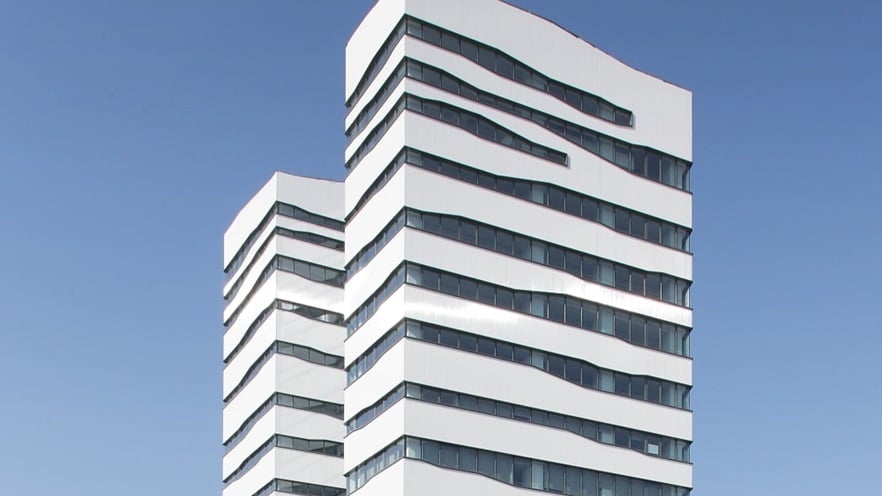 The building is white with glass facades