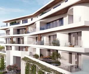 The large balconies have glass railings