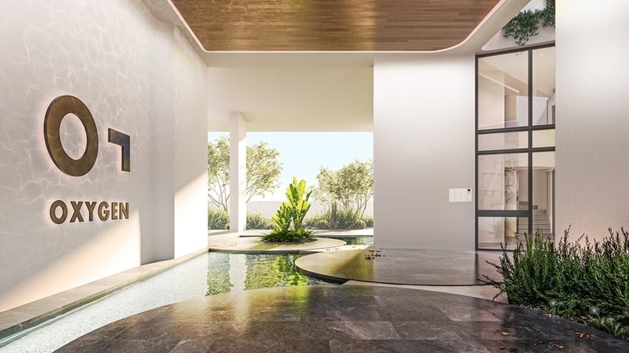 The lobby has plants and a water element