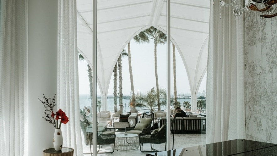 The indoor overseeing the outdoor area through a large window