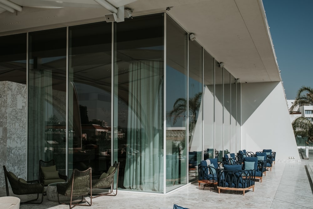 The terrace is equipped with sitting areas in blue tones