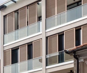 The balconies have glass railings
