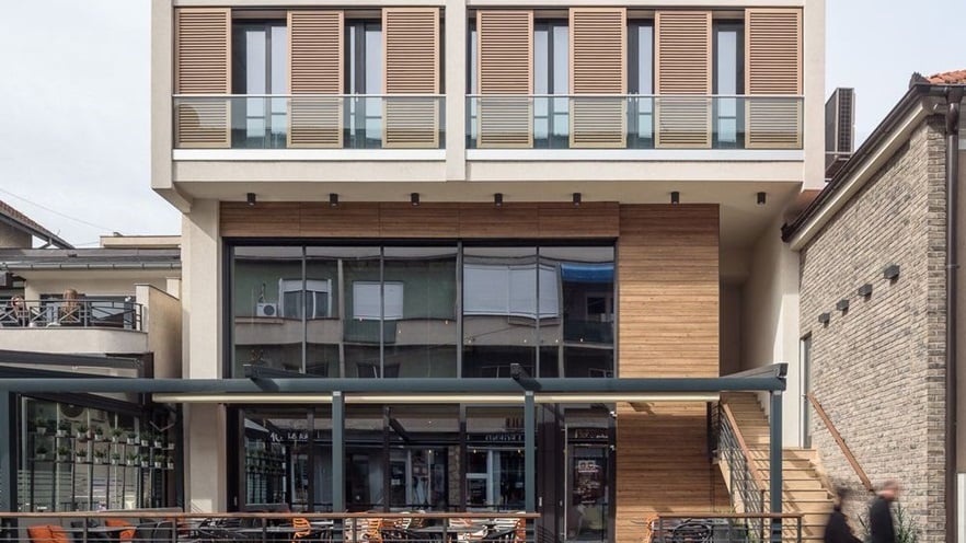 The two bottom floors of the building are a restaurant with a large terrace
