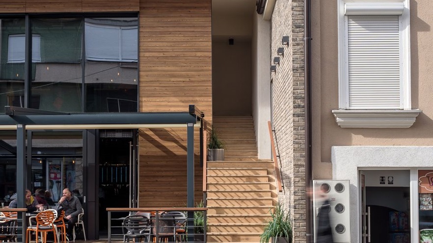 The staircase that leads to the residences is located in between the two buildings