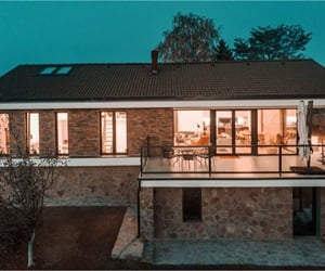 The back of the stone house with the balcony