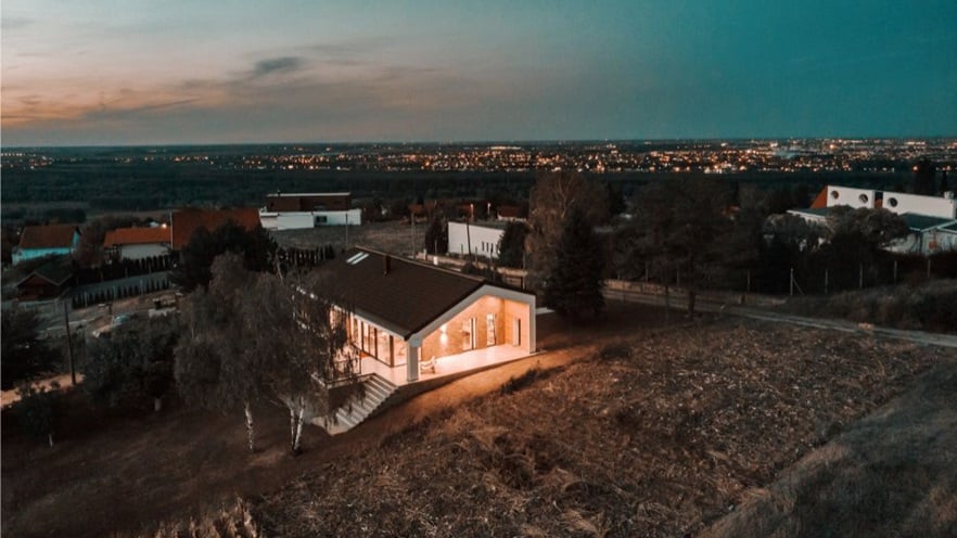 The house in the neighborhood with lights on