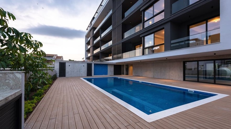 The building has a spacious pool area