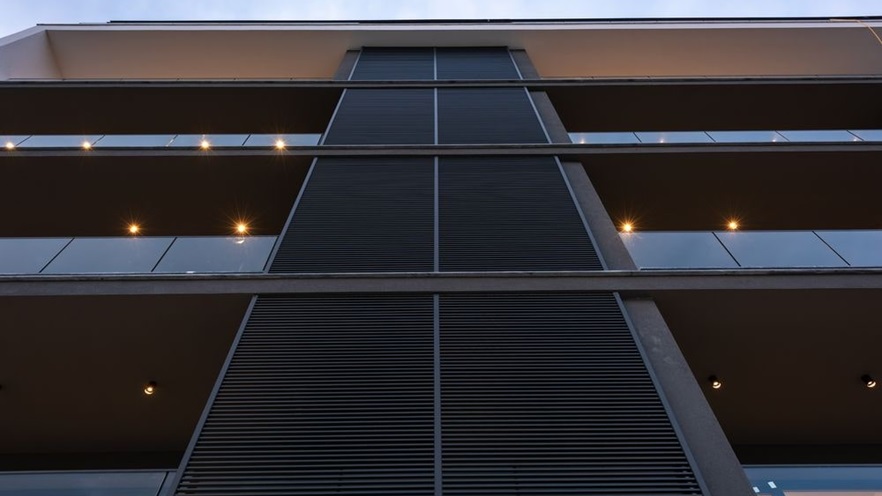 Shading louvers cover a part of the building