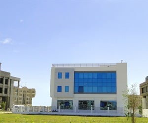 The side of the building and the fence