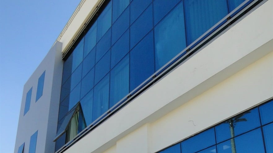 Close up to the side of the building with the glass façade