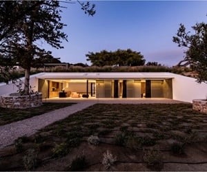 The house façade and the courtyard at night