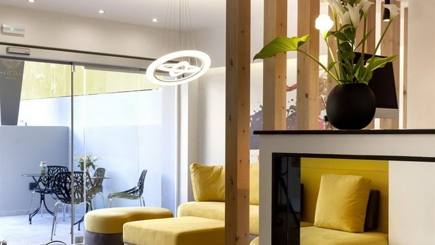 The lobby with a yellow sofa and wooden details