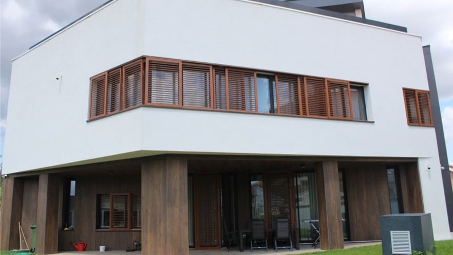 The building is white with wooden details