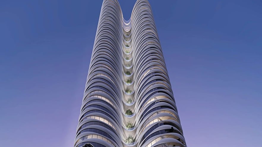 The tower has balconies and windows on all floors