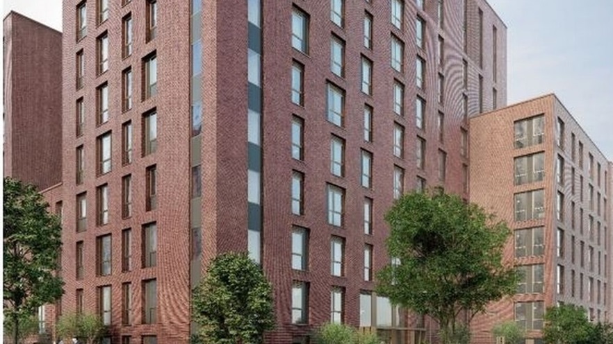 The brick buildings have lots of windows from top to bottom