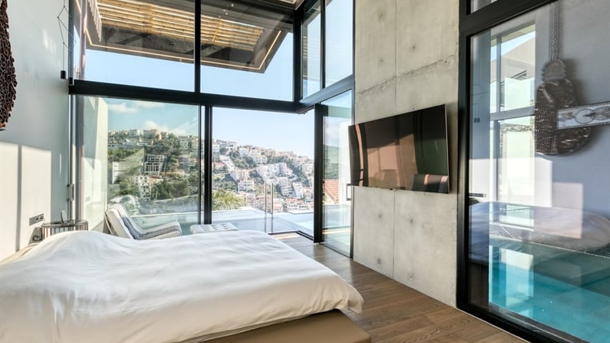 Minimal master bedroom with glass windows