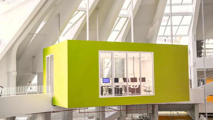 The green rectangular room stands out in the white surroundings