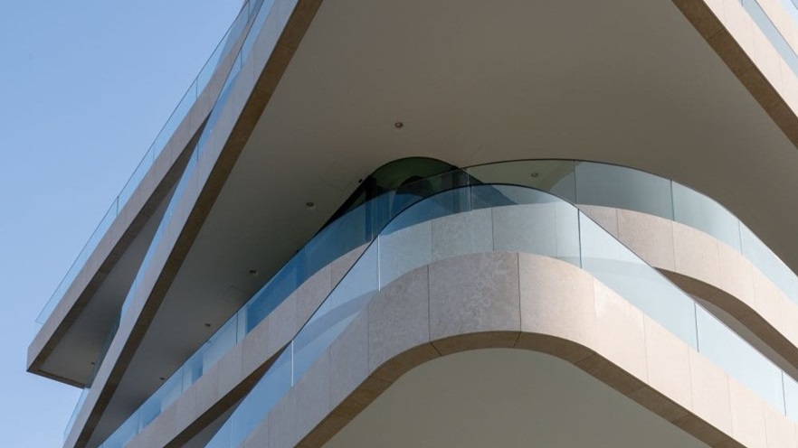 A look at the curvy corners of the balconies from below