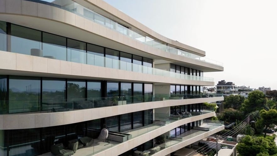 The building has windows and big balconies all around